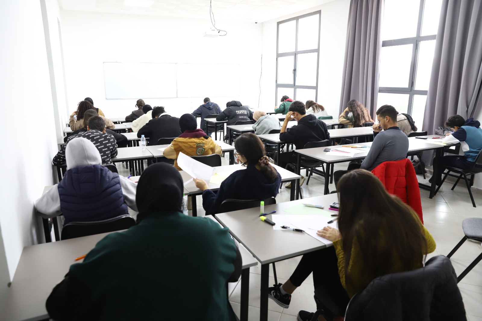 Students collaborating on academic projects in a bright university setting, modern campus environment